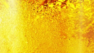 Close up of the beer bubbles. Macro shot, abstract background.
