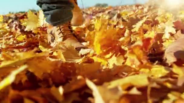 Super Slow Motion Man Walking Autumn Leaves Filmed High Speed — Stockvideo