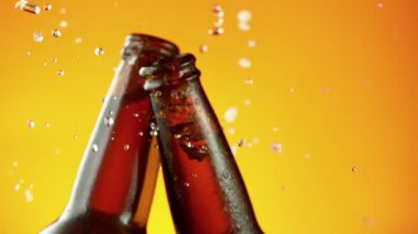 Super slow motion of hitting beer bottles together, cheers concept. Filmed on high speed cinema camera, 1000 fps. Speed ramp effect.