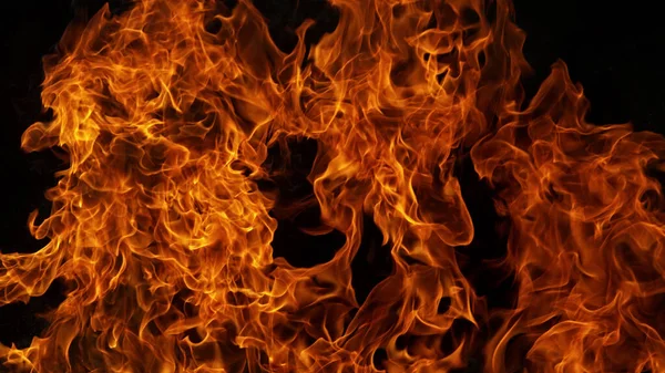 黒い背景に炎の炎の背景 — ストック写真