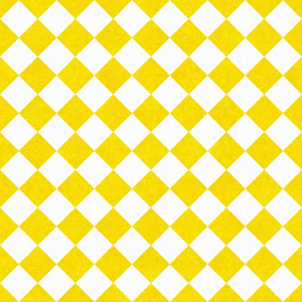 Gele en witte diagonale checkers op geweven stof achtergrond — Stockfoto