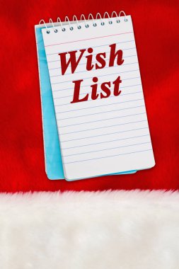 Noel Dilek Listesi iletisi beyaz ve kırmızı peluş malzeme üzerine bir not defteri