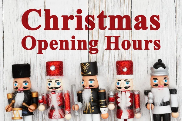 Christmas Opening Hours Sign Five Nutcrackers Christmas Border Weathered Wood — Stock Photo, Image