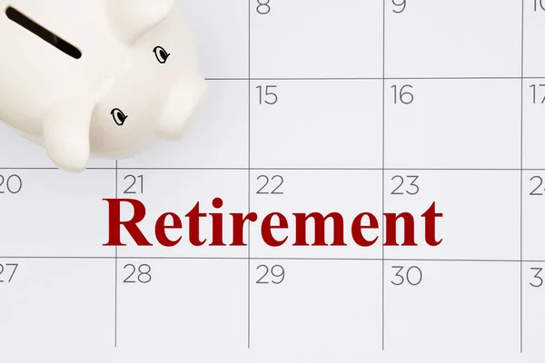 Μήνυμα Συνταξιοδότησης Ένα Λευκό Κουμπαρά Ένα Ημερολόγιο — Φωτογραφία Αρχείου