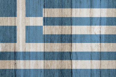Arka plan için yıpranmış ahşap üzerinde eski bir Yunan bayrağı