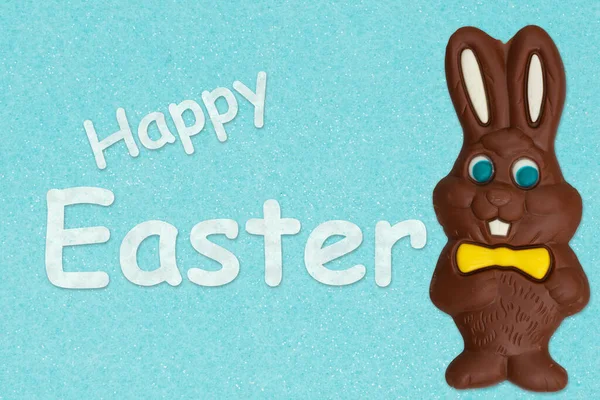 Happy Easter teal greeting card with chocolate Easter Bunny for your holiday message