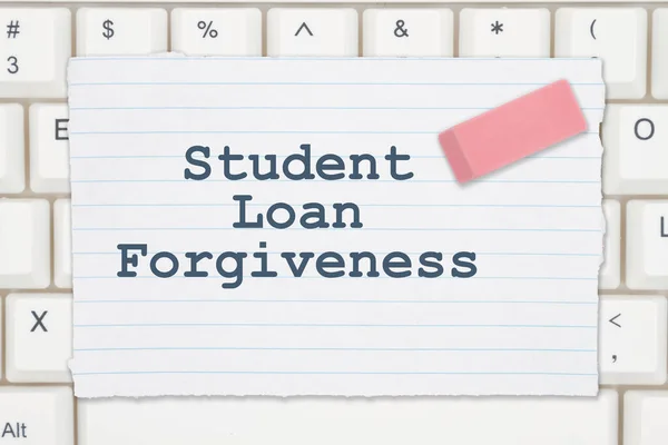 Student Loan Forgiveness message on ruled paper with eraser on a keyboard