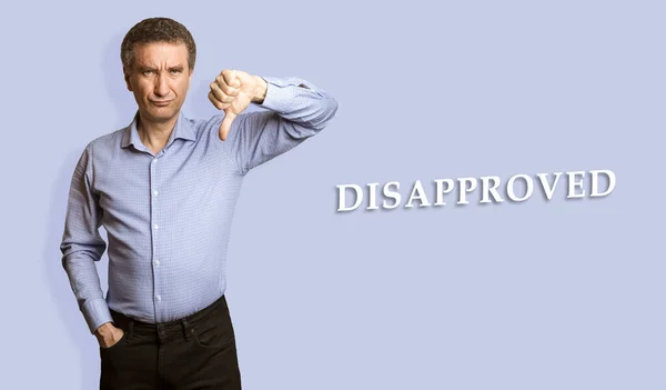 Portrait Dishappy Upset 50S Man Gesturing Thumbs Expressing Rejection Studio Stok Gambar Bebas Royalti