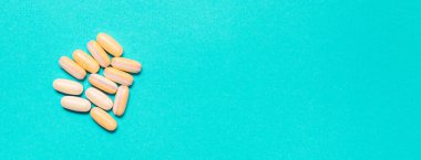 Medicine debate concept. Biotechnology banner with pills. Copy space for text. flatlay.