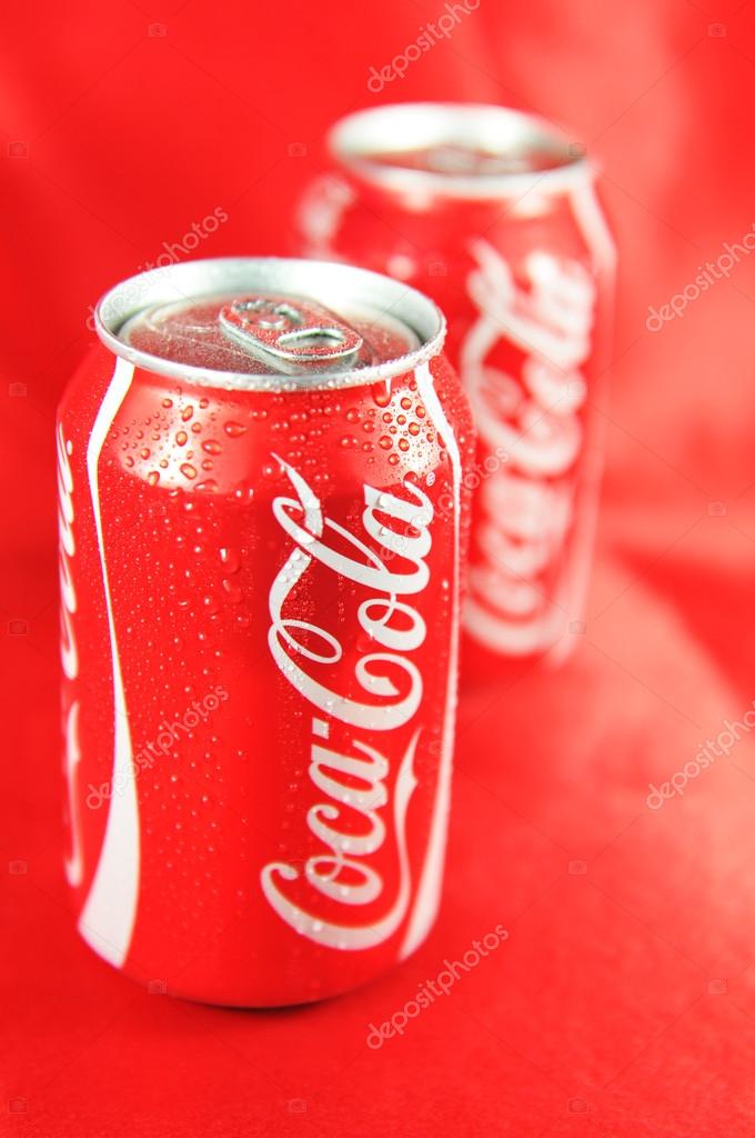 Detail  of fresh Coca Cola can on red background