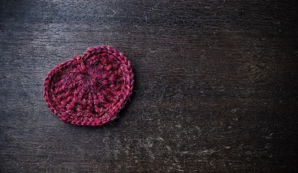 Knitted red heart on a wood background — Stock Photo, Image