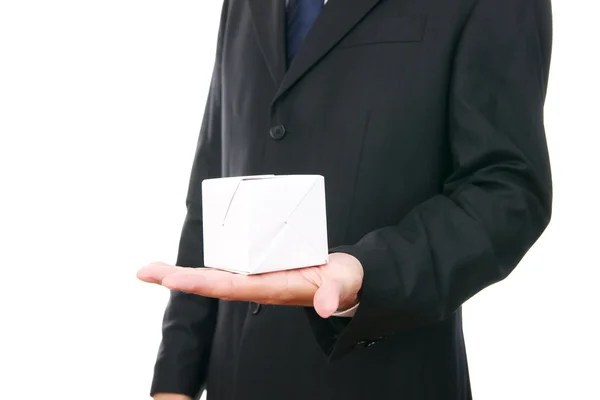 Homem de negócios com cubo na mão — Fotografia de Stock