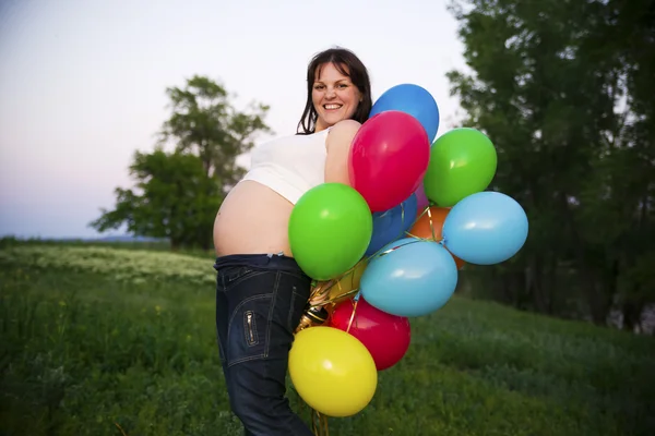 Pregnant woman in nature Royalty Free Stock Images
