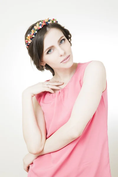 Young beautiful woman with flower wreath on head — Stock Photo, Image