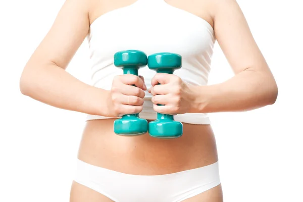 Girl with green dumbbells in hand — Stock Photo, Image