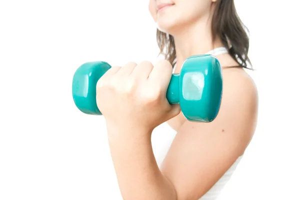 Girl with green dumbbells in hand — Stock Photo, Image