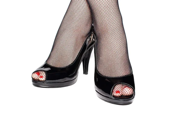 Az elszigetelt fekete cipő női lábak — Stock Fotó