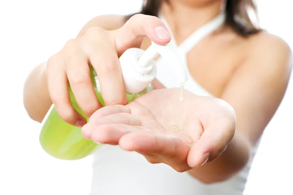 Liquid soap in female hands — Stock Photo, Image