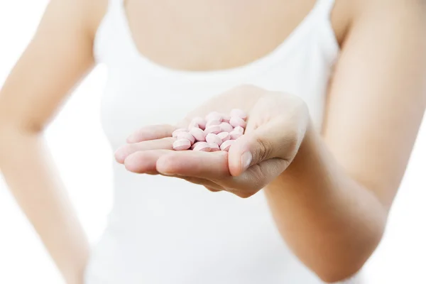 Pastillas en la mano de las mujeres — Foto de Stock