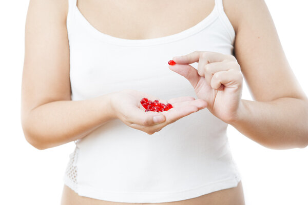 Таблетки в руках женщин
