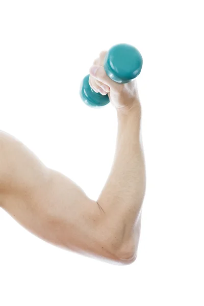 Green dumbbell in male hand — Stock Photo, Image