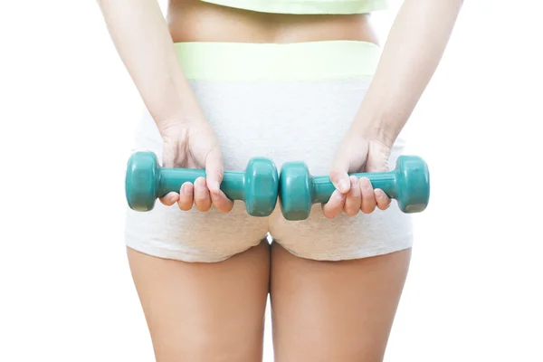 Young woman doing exercises with dumbbells — Stock Photo, Image