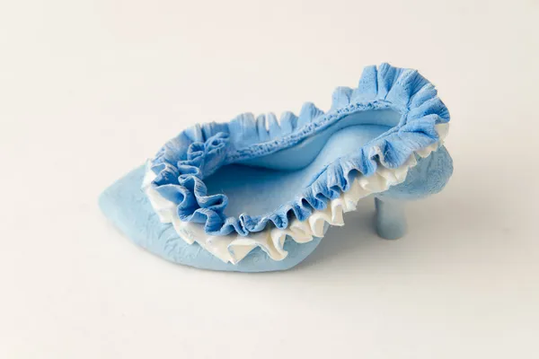 Toy shoe from clay on a white background — Stock Photo, Image