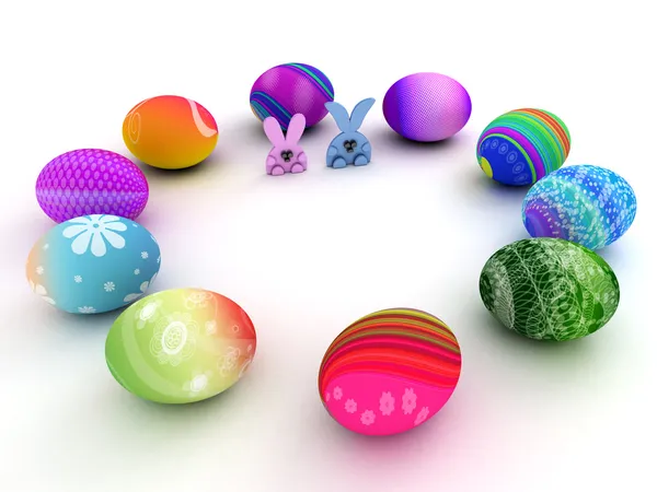 Easter bunnies and colorful eggs isolated on white background — Stock Photo, Image