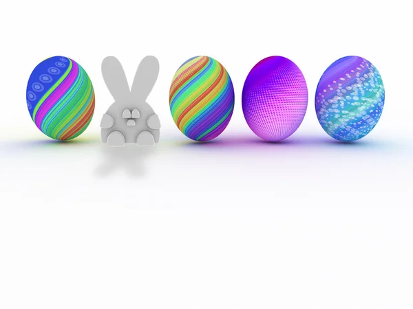 Conejo de Pascua y huevos coloridos aislados sobre fondo blanco —  Fotos de Stock