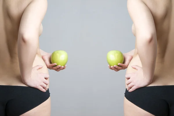 Corps féminin avec pomme verte — Photo