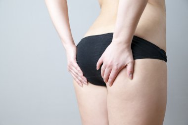 Buttocks massage against cellulite clipart