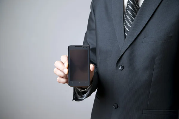 Moderno telefone celular na mão masculina — Fotografia de Stock