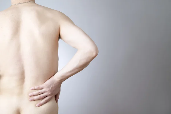 Pain in the lower back in men — Stock Photo, Image