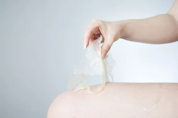 Peeling for skin thighs against stretch marks and cellulite — Stock Photo, Image