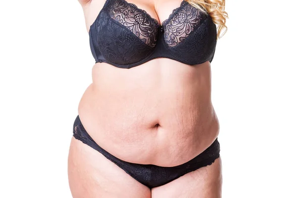Plus size model in black lingerie, overweight female body, fat woman with  flabby stomach isolated on white background Stock Photo by ©starast  138180764