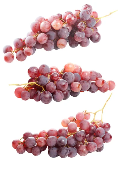 Smakoszki czerwonych winogron, na białym tle — Zdjęcie stockowe
