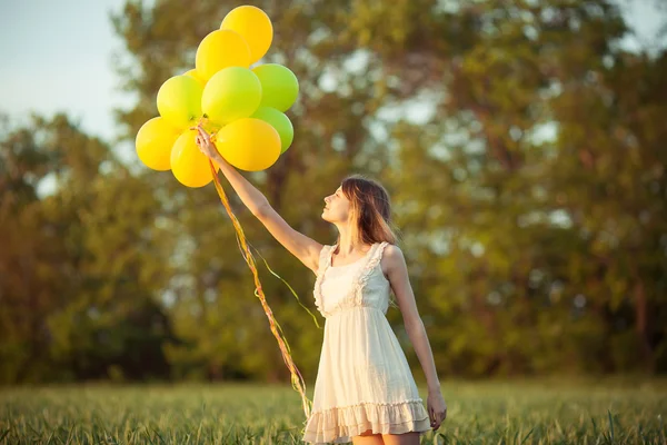Chica con globos Fotos De Stock
