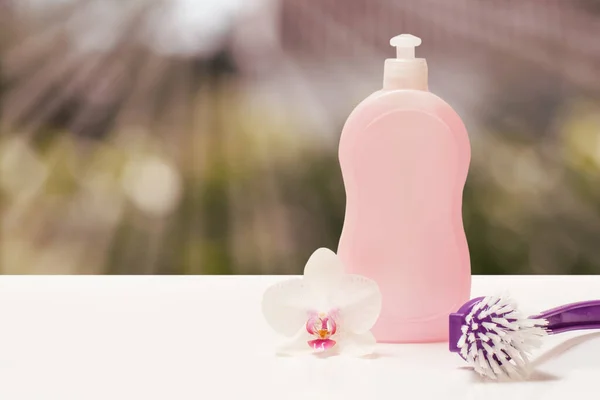 Bottle Dishwashing Liquid Brush Orchid Flower Blurred Natural Background Sun — Stock Fotó