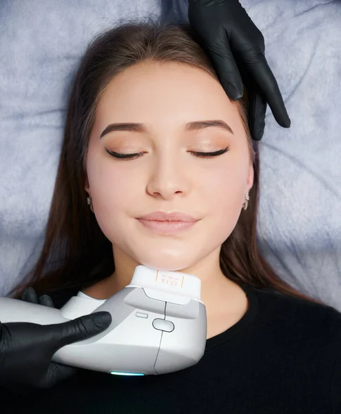 Beautician doing cleaning face for young cute woman. — Stock Photo, Image