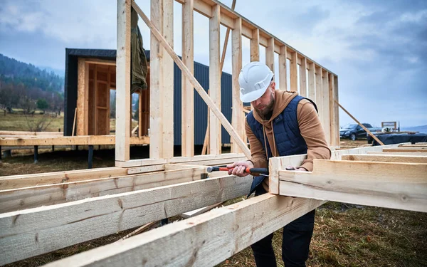 Man Worker Building Wooden Frame House Pile Foundation Carpenter Hammering — Stockfoto