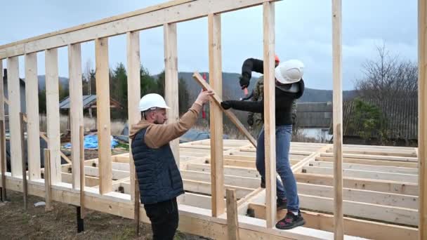 Man Worker Building Wooden Frame House Pile Foundation Carpenter Hammering — Stock Video