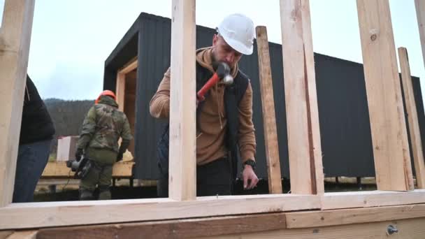 Man Worker Building Wooden Frame House Pile Foundation Carpenter Hammering — Wideo stockowe