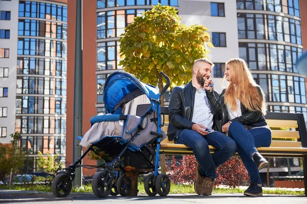 Happy Family Sitting Together Unrecognizable Baby Blue Pram Modern Courtyard — 图库照片