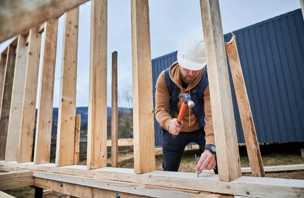 Man Worker Building Wooden Frame House Pile Foundation Carpenter Hammering — Foto Stock