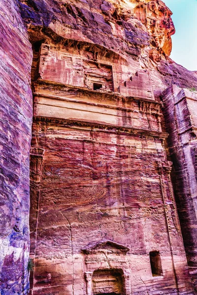 Rose Red Rock Tomb Street of Facades Petra Jordan Built by Nabataens in 200 BC to 400 AD.Yellow tombs become rose red in afternoon.