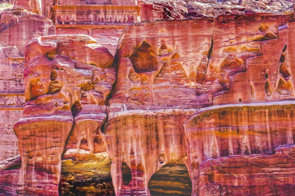 Rose Red Rock Tombs Street of Facades Petra Jordan Built by Nabataens in 200 BC to 400 AD Canyon walls create many colorful abstracts close up