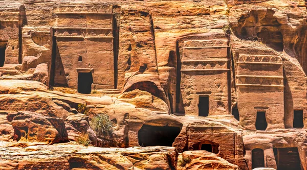 Rock Tombs Morning Street of Facades Petra Jordan Built by Nabataens in 200 BC to 400 AD Canyon walls change Rose Red afternoon when sun goes down