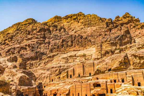 Yellow Rock Tombs Morning Street of Facades Petra Jordan Built by Nabataens in 200 BC to 400 AD Canyon walls change Rose Red afternoon when sun goes down