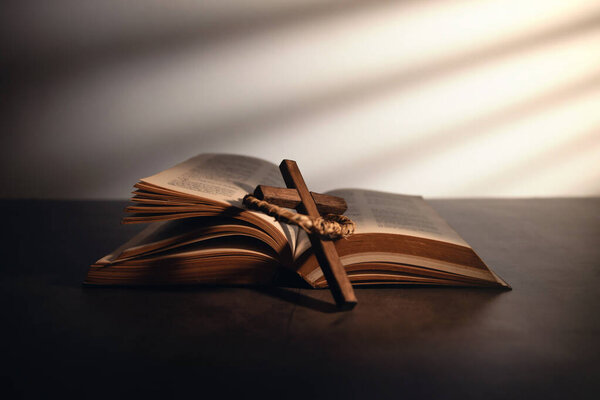 Spirituality, Religion and Hope Concept. Holy Bible and Cross on Desk. Symbol of Humility, Supplication,Believe and Faith for Christian People