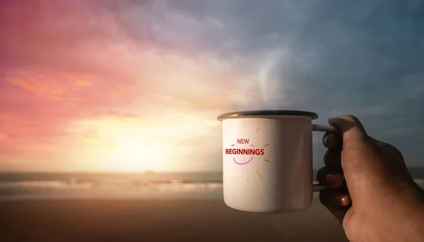 Start a New Day. New Beginning Concept. Drinking Hot Coffee by the Beach during Sunrise. Hand Holding a Cup to Enjoying Favorite Drink and Nature. Harmony Living Lifestyle. POV View